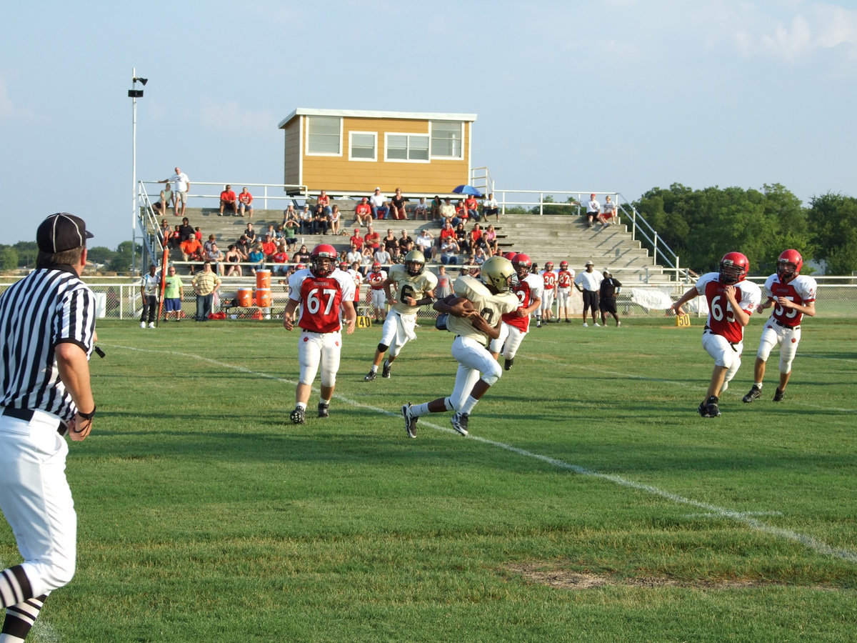 Image: Looking for yards — Trevon Robertson(9) returns a kickoff against Maypearl.