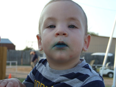 Image: Kix is blue — You too can achieve this blue appearance if you purchase refreshments from the concession stand. Coach Bales son, Kix, experienced the first ring pop of his life at the game.  I think he liked it.