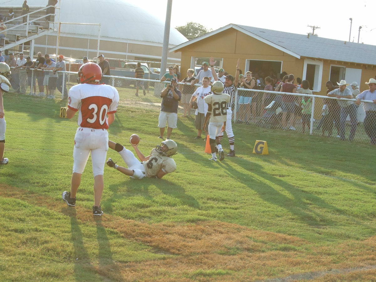 Image: Crossing the line — Tony Wooldridge(6) crosses the goal line. Tell the score guy to put another 6 points on the board.