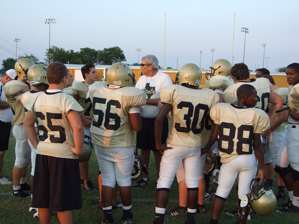 Image: Italy’s JV team — Coach Stephen Coleman takes a minute to wrap up the victory with his team.