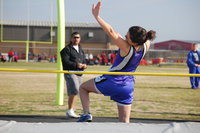 Image: High jump — Rachel Strange sails over the high jump bar to advance to area competition.