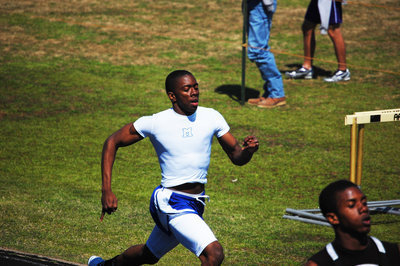 Image: Jamaar Davis — Jamaar Davis finishes off competitors in the 200 meter run.