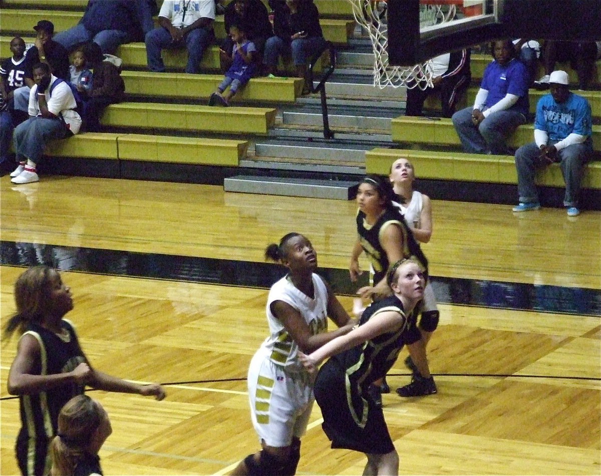 Image: Brianna battles inside — Brianna Burkhalter(22), under the basket, is determined to get this rebound.