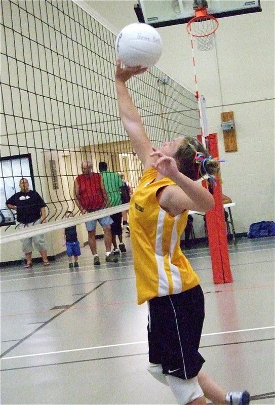 Image: Over the top — Italy’s Tara Wallis strategically drops the ball back over the net for a point.