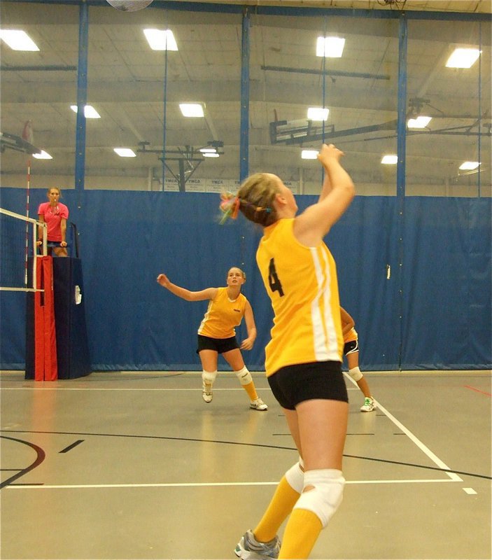 Image: Save for a point — Kelsey Nelson sends the ball back over her head for a point against Maypearl.