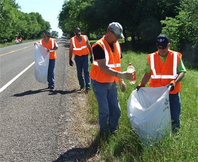 Image: Road warriors — Members of the Southern Cruisers Riding Club parked their motorcycles and went afoot to collect trash from the roadway.