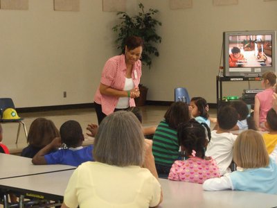 Image: Mrs. Small giving presentation — Students are listening with interest to Mrs. Small.