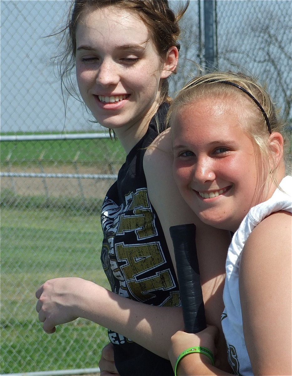 Image: The lighter side — Melissa Smithey gets a hug from teammate Drenda Burk.