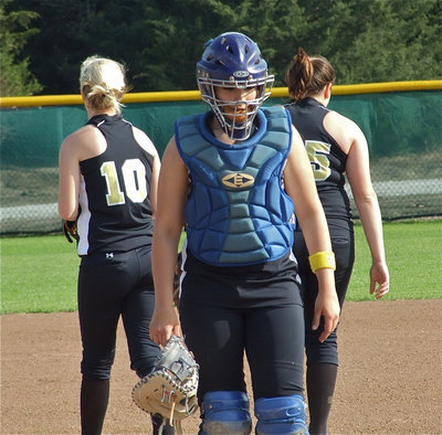 Image: Let’s get it done — Catcher Alyssa Richards heads back behind he plate after chatting with pitcher Courtney Westbrook(10) and 2nd baseman Cori Jeffords(15).