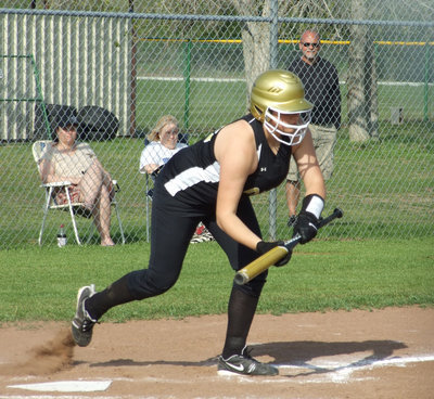 Image: Cori bunts — Cori Jeffords tries to execute a bunt against the Lady Jags.