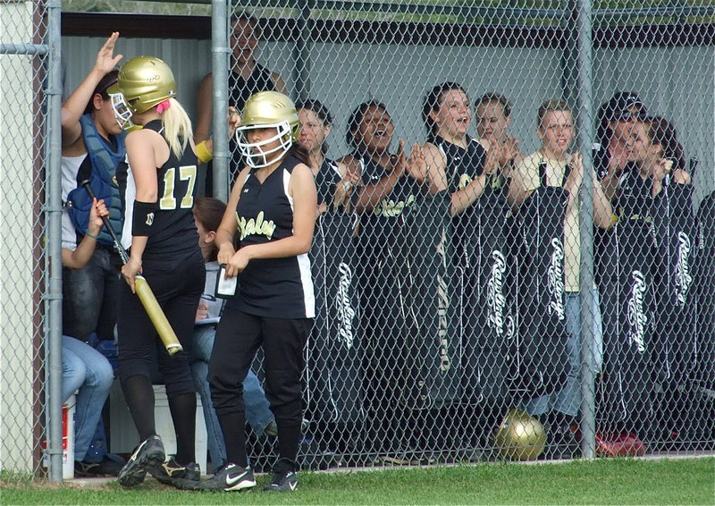Image: Getting rowdy — The Lady Gladiator dugout feels the momentum changing.
