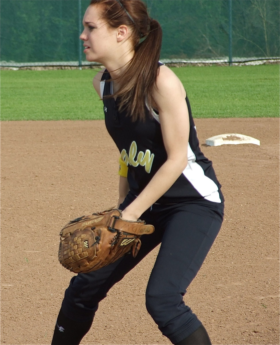 Image: Windham in the wind — First baseman Drew Windham felt the strong breeze at her back as the sand became a problem for both teams.