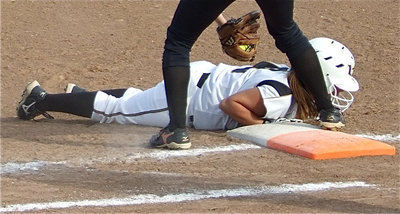 Image: Almost! — Italy catcher Alyssa Richards tries to catch the Jaguars napping at first base with Drew Windham going for the tag.