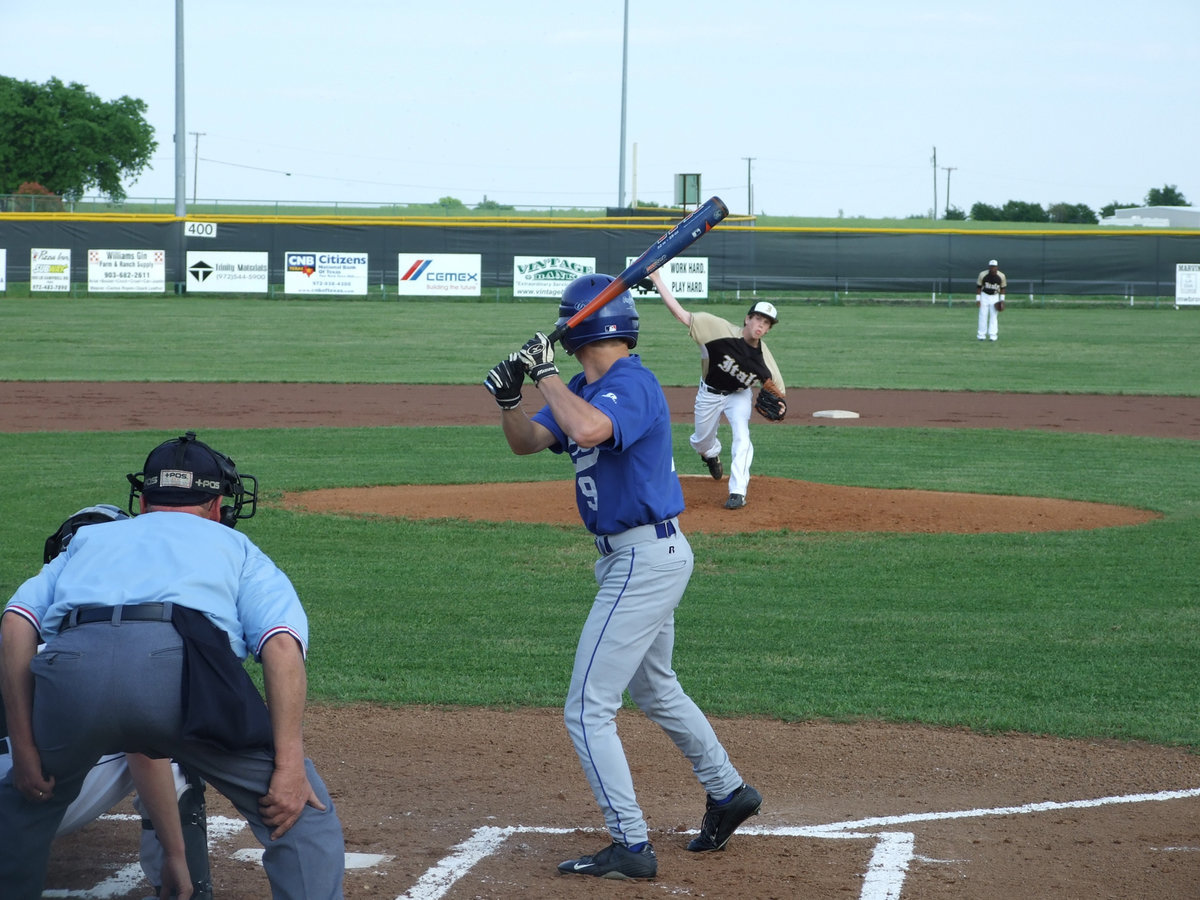 Image: Bring it, Justin — Justin Buchanan works hard on the mound.