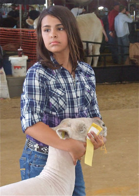 Image: Ashlyn Jacinto — Ashlyn Jacinto exits the show ring with her lamb.