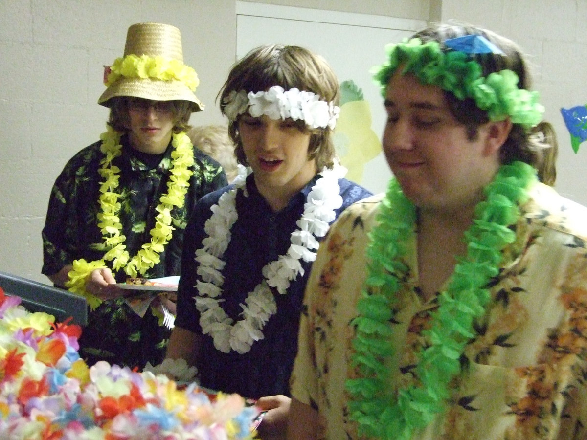 Image: We are dressed for the occasion — Dillon Wright, Jeremy Worsham and Colin Wilsford explore the food cart.