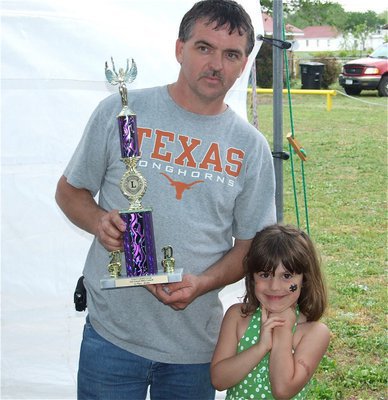 Image: Gary wins 1st Place — Gary Wood from the IYAA team receives a 1st place trophy in the Brisket Category form Taylor Souder.
