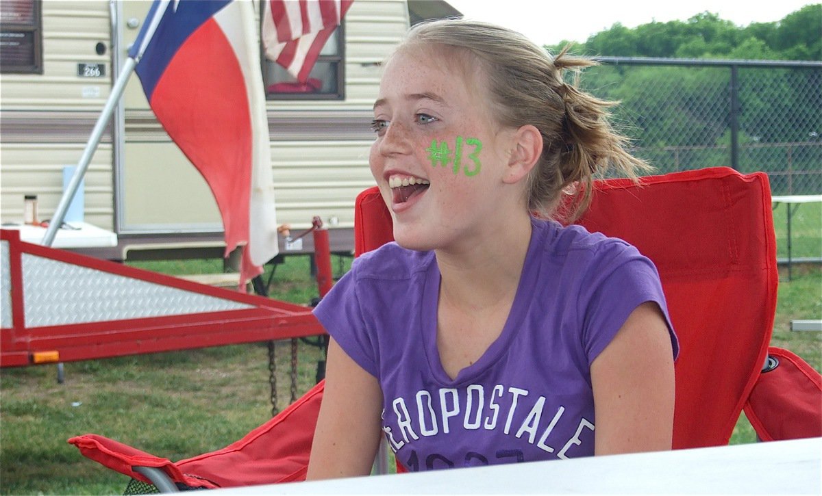 Image: I heard that! — Another victim of “Darla Wood’s Noise Makers,” Hannah Washington realizes she is sitting on the wrong side of the grill.