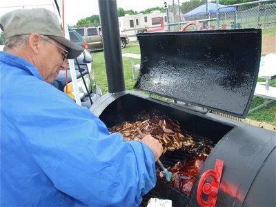 Image: Waldo’s Smokehouse — “On Friday night we were all friends, sharing trade secrets and special mixes. On Saturday, nobody likes anybody,” laughed Gary Waldo of Waxahachie, Texas, and a member of the Lone Star BBQ Society,