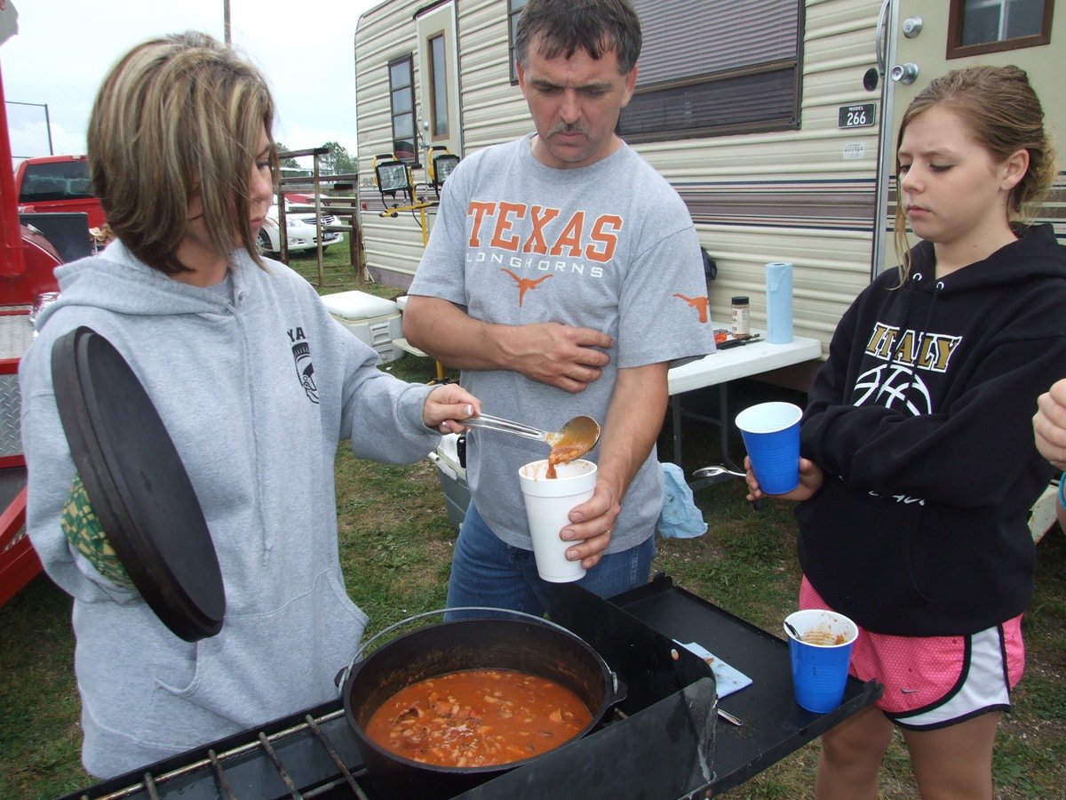 Image: Beans for breakfast — Nothing says good morning like “Darla’s Noise Makers” that won 1st place in the bean contest. Darla Wood serves husband Gary Wood and daughter Brooke DeBorde the breakfast of champions.