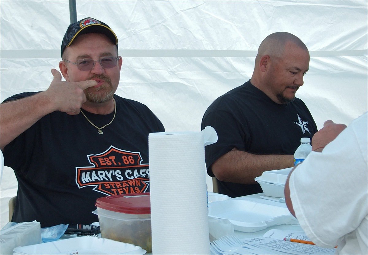 Image: Time of their lives — Robert Sollers and Craig Bales were as happy as two judges in a BBQ Cook-off could be.