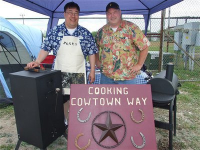 Image: Cowtown cooks — Jerry Huey and Roger Graves of Fort Worth, Texas enjoy the grill of competition!