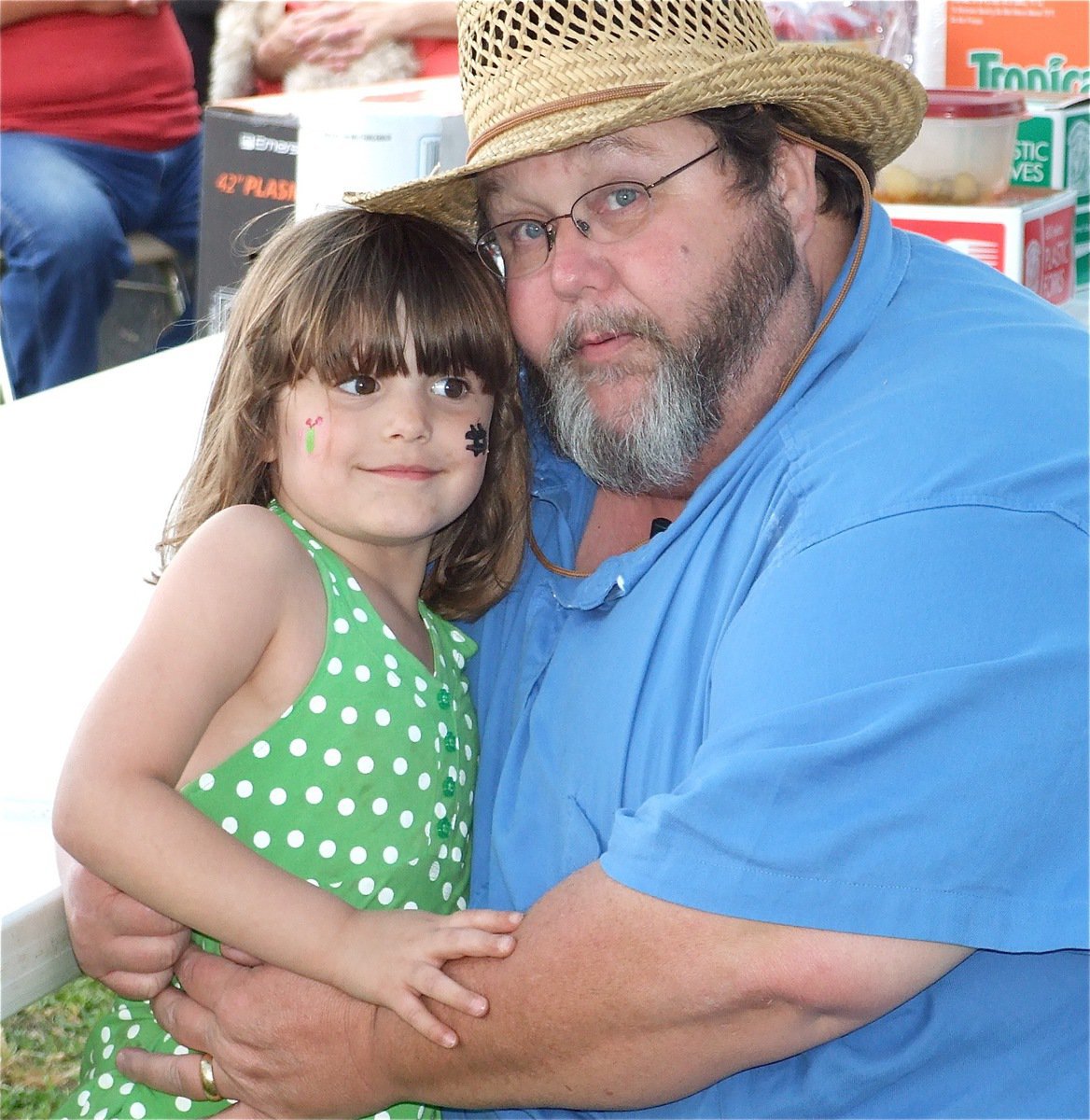 Image: We love BBQ! — Taylor Souder gives Italy Lion Club’s President Arval Gowin a hug before the awards are passed around during the club’s 2nd Anuual Cook-off held in Italy.