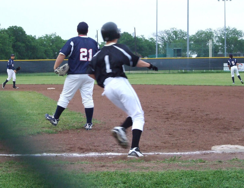 Image: Ross hits a grounder — The Mustangs had a hard time keeping up with the Gladiators Thursday night.