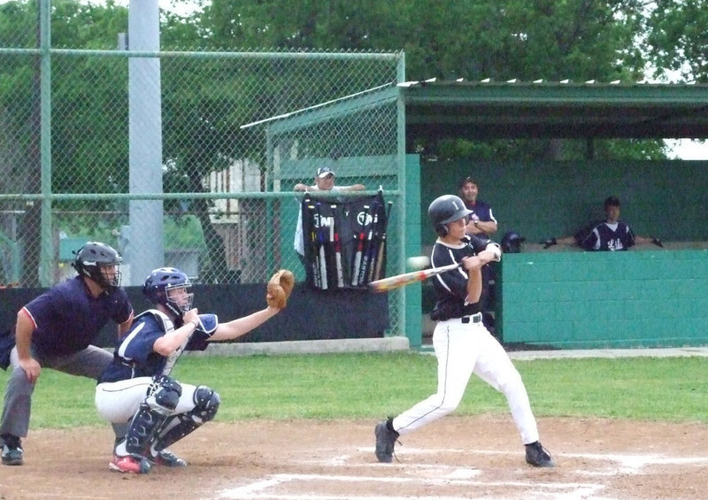 Image: Souder takes a swing — Brandon puts the ball in play.
