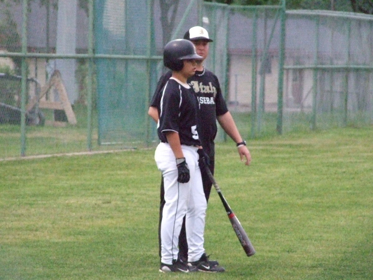 Image: Reid listens to the plan — Coach Ward give a few pointers to Reid Jacinto.