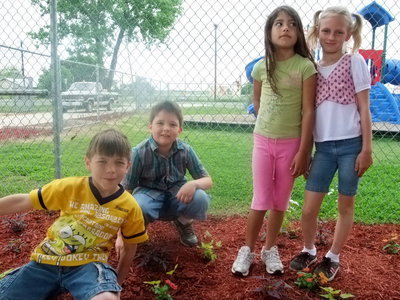 Image: Take My Picture Please — Rody Meier, Matthew Ozymy, Angelina Covariubias and Kristen Ozymy are ready for their picture to be taken with their garden.