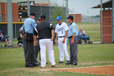 Image: Let’s play ball — The umpires and the coaches meet at home.