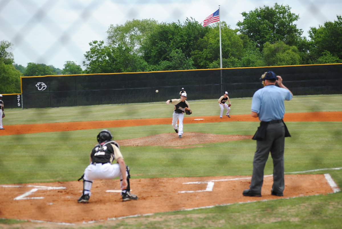 Image: Buck warms up — Ryan Ashcraft catches Justin Buchanan for the game.