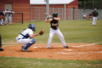 Image: Josh hits hard — Senior Josh Milligan plays his last game of high school.