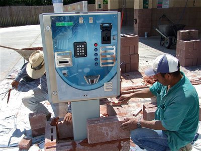 Image: Bricking it in — Work crews brick in the Hamilton Machine Cashier marking the entrance to the Water Wizard 2.0.