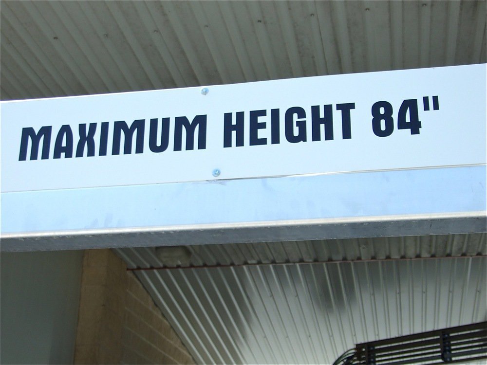 Image: Maximum Height 84" — Most vehicles can enter under the Water Wizard 84" Clearance sign. Even Hyles C5 Car Wash owner, 6’4" Charles Hyles, can walk under the sign without ducking.