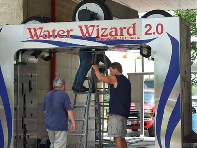 Image: Most vehicles will fit — The Water Wizard can handle low and tall vehicles as long as they can drive under the maximum height of 84" allowed. Customized vehicles and raised trucks may not fit and extended side view mirrors will need to be turned in toward the car.
