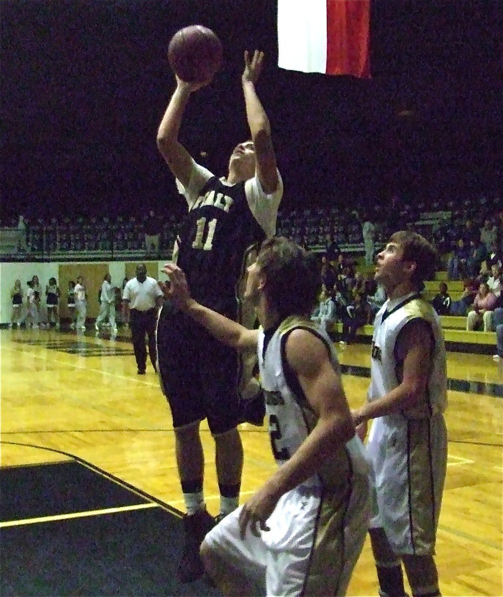 Image: Souder scores easy — Brandon Souder(11) scoops up the loose ball and scores easy as the Italy JV Gladiators gave the Palmer Varsity squad a scare.