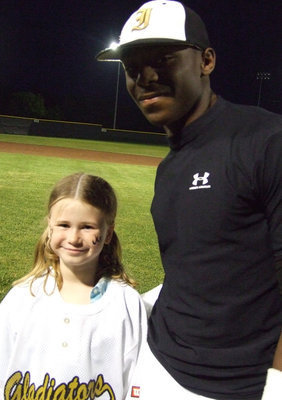 Image: Desmond and Kimberly Hooker — This young lady was able to receive Desmond Anderson’s jersey.