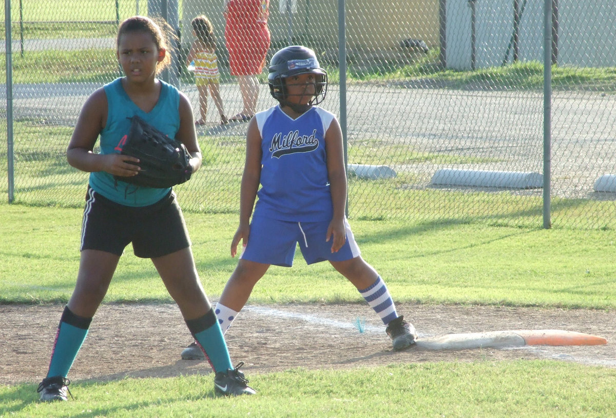 Image: I’m on first — Milford’s Katera Birdow stretches out and gets ready to run.