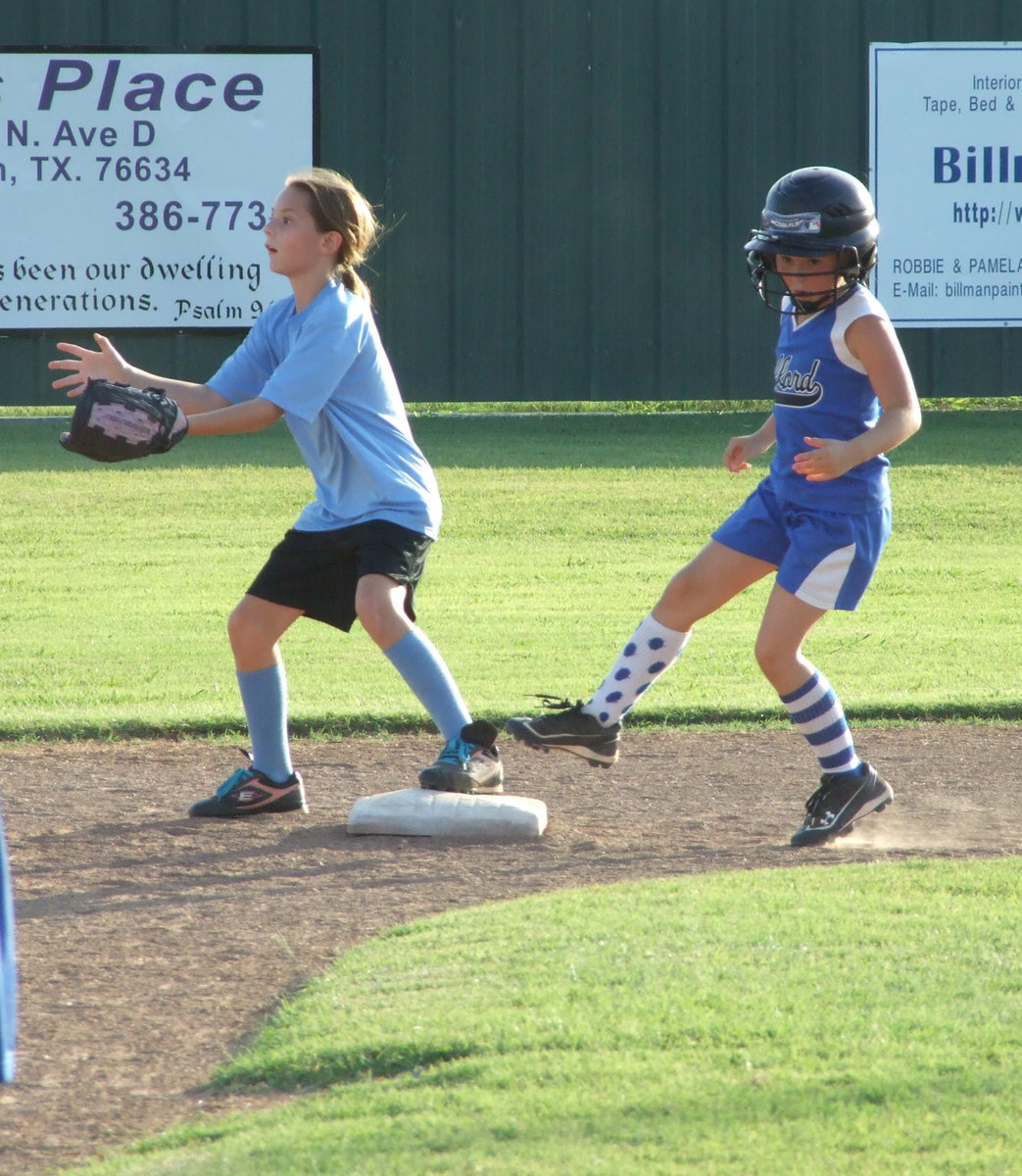 Image: Almost there — Milford’s Bree Brown beats the throw.