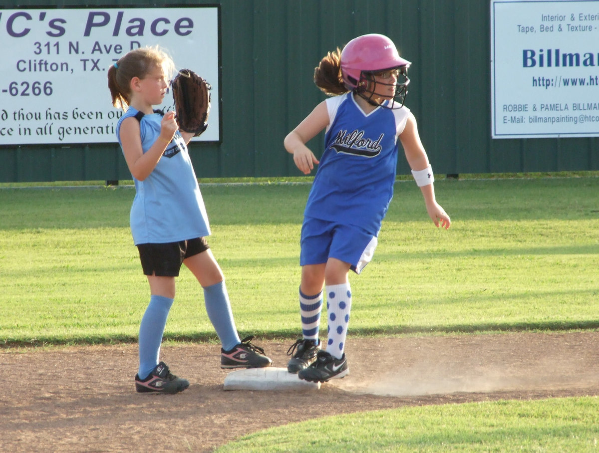 Image: Safe at second — Milford’s Sarah Sanders makes easily it to second.