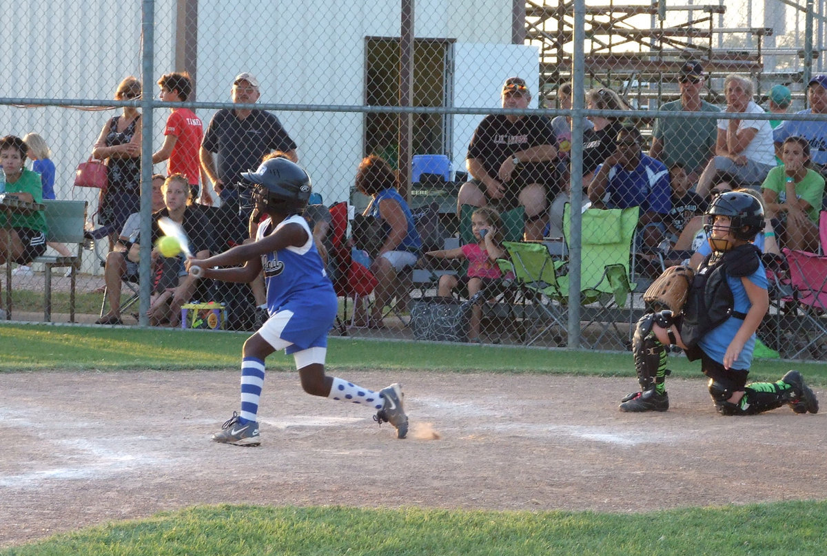 Image: Markia lets the ball have it — Markia Houston gives Lindale something to think about.