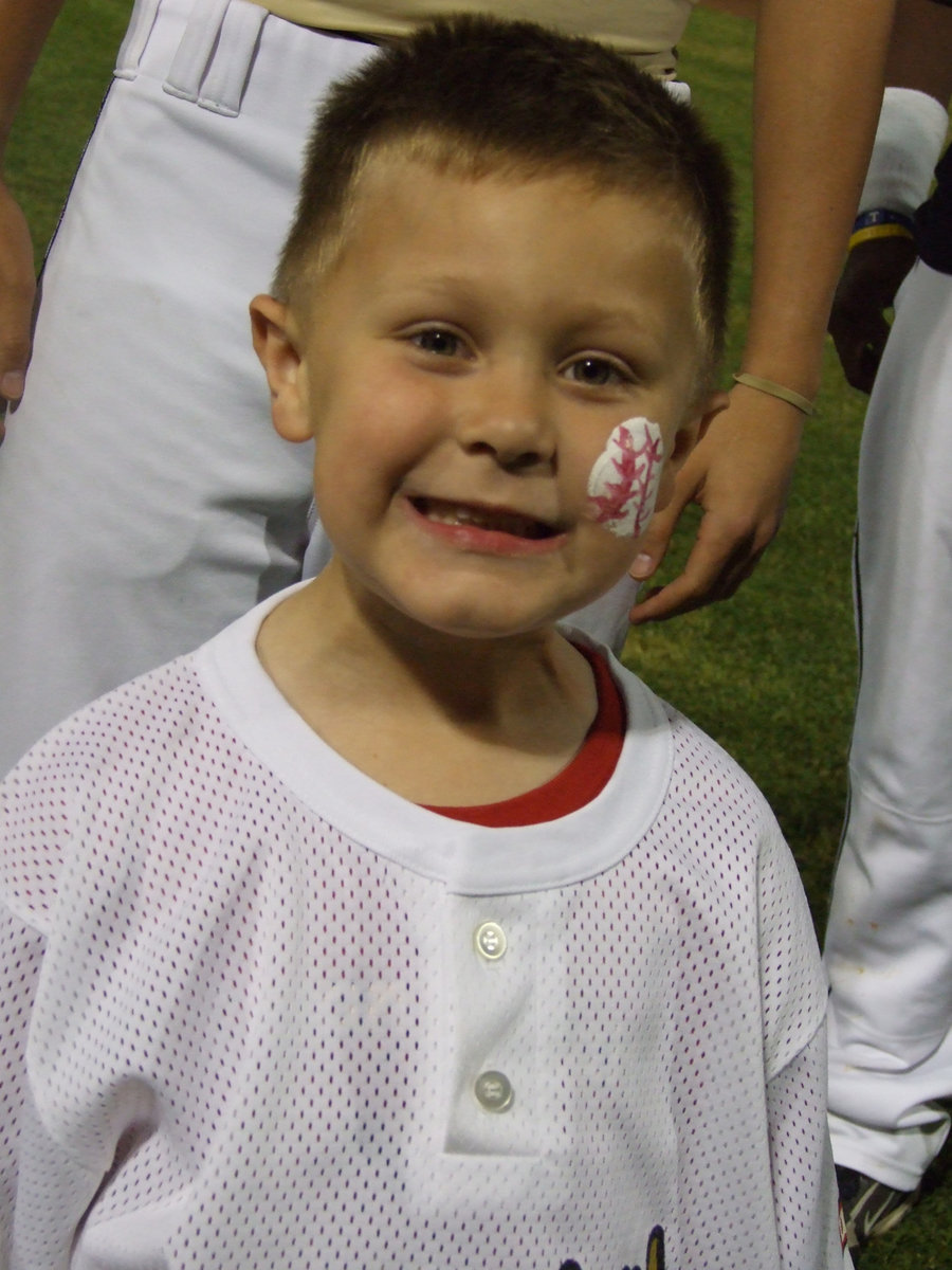 Image: I am so happy — You can’t get any better than this, Jacob Coers says.  He received a varsity t-shirt from one of his favorite players.