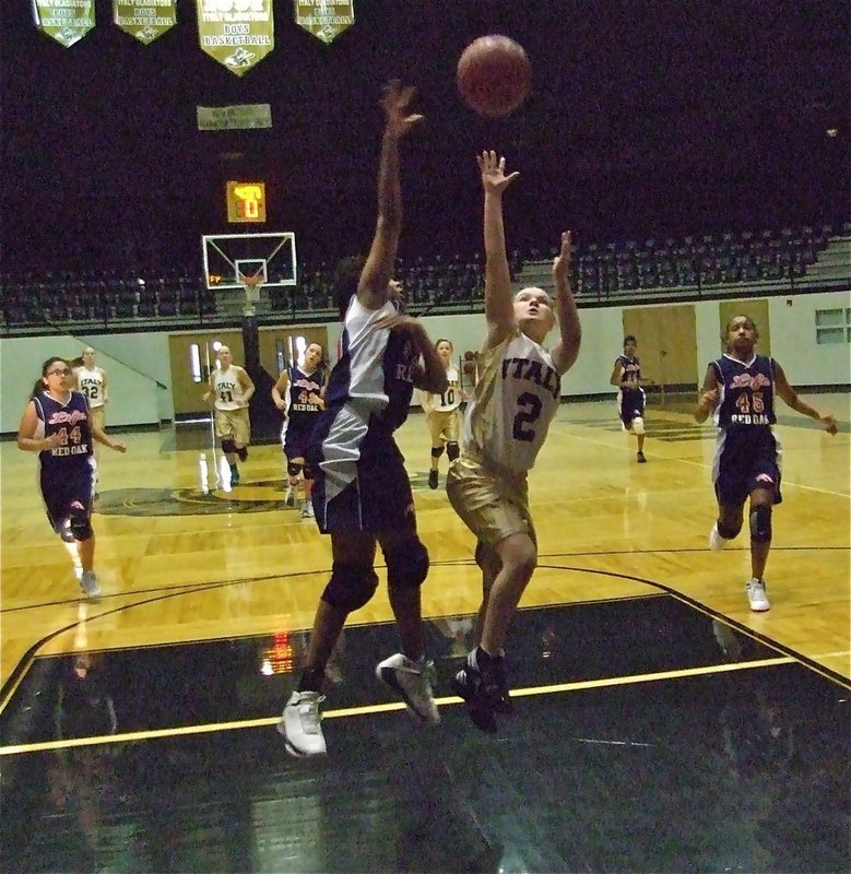 Image: Tara terrorizes ROL — Italy 7th grader Tara Wallis(2) steals the ball and drives all the way to the basket. Since she scored, Officer Morgan decided not to right her a speeding ticket for driving too fast in the lane.