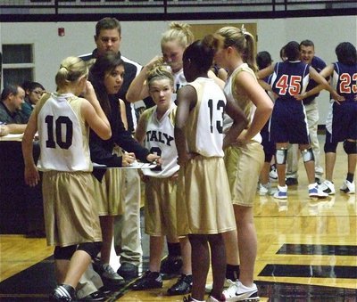 Image: Both sides huddle — Coaches Tina Richards and Matt Coker have a plan to finish off the Lady Eagles.