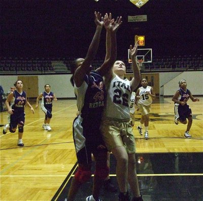 Image: Jesica boards — Italy 8th grader, Jesica Wilkins(22), fights for the rebound.