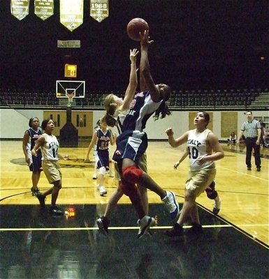 Image: Taylor challenges — Italy 8th grader, Taylor Turner(31), challenges a Red Oak Life player for the rebound.