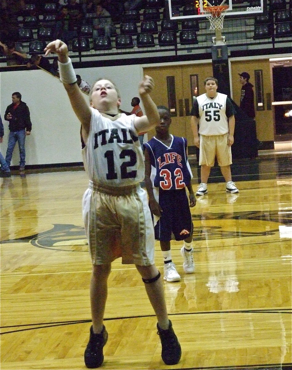 Image: J.T. drops one — Point guard J.T. Escamilla(12) makes a point for the 7th grade squad from the charity stripe.