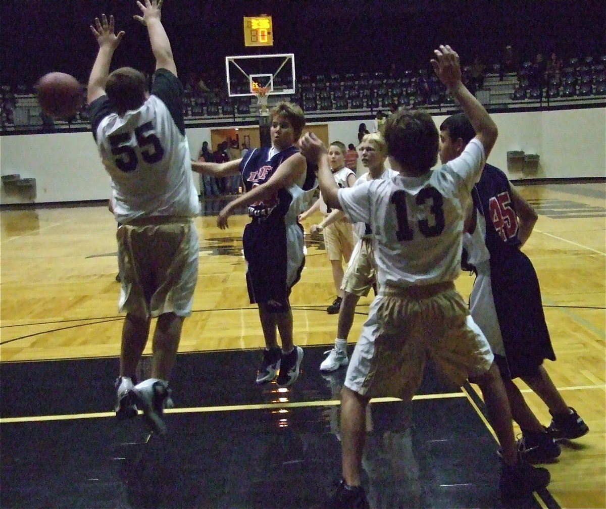 Image: Kelton defends — Italy 7th graders Kelton Bales(55) and Chace McGinnis(13) play tough in the zone.